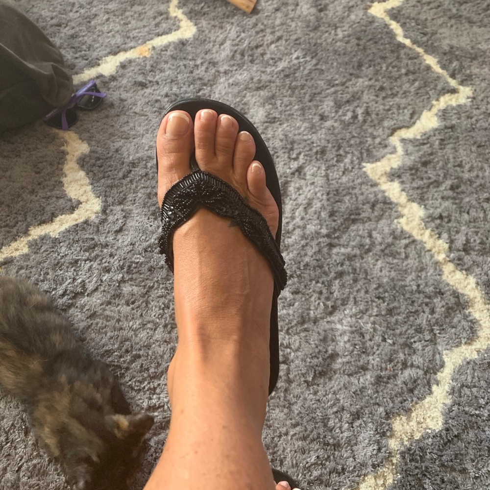 Black beaded flip flops